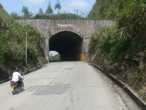 Tunnel at a pass to protect from falling debris.